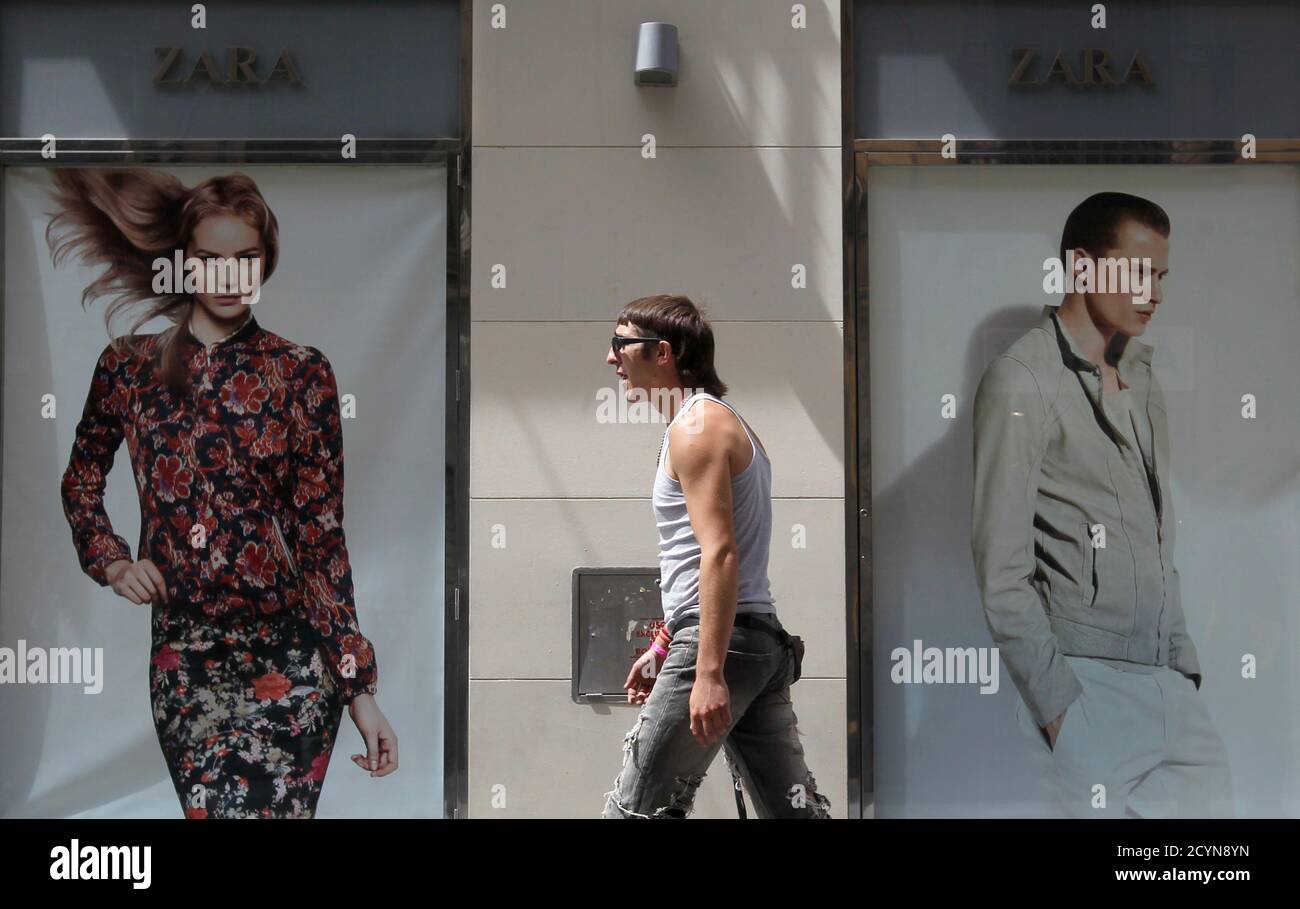 A man walks past a Zara store in Madrid June 13, 2012. Spain's Inditex SA,  the world's largest clothes retailer, bucked Europe's financial crisis with  a sharp rise in quarterly earnings by