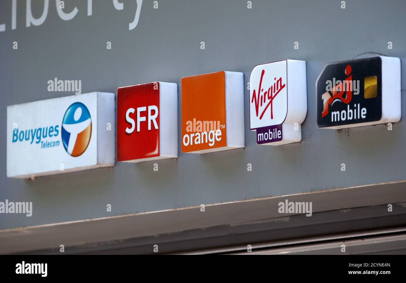 French telecom operators Bouygues Telecom, SFR, Orange, Virgin Mobile and  NRJ Mobile logos are seen on a mobile phone store in Paris, May 16, 2014.  French telecoms market leader Orange is in