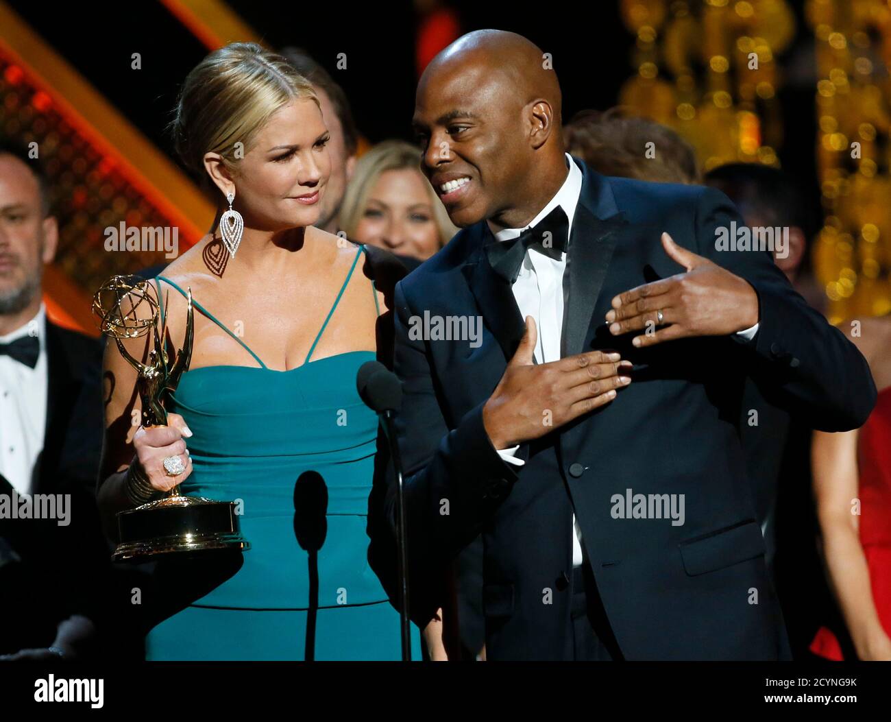 Journalists Nancy O'Dell and Kevin Frazier accept the award for