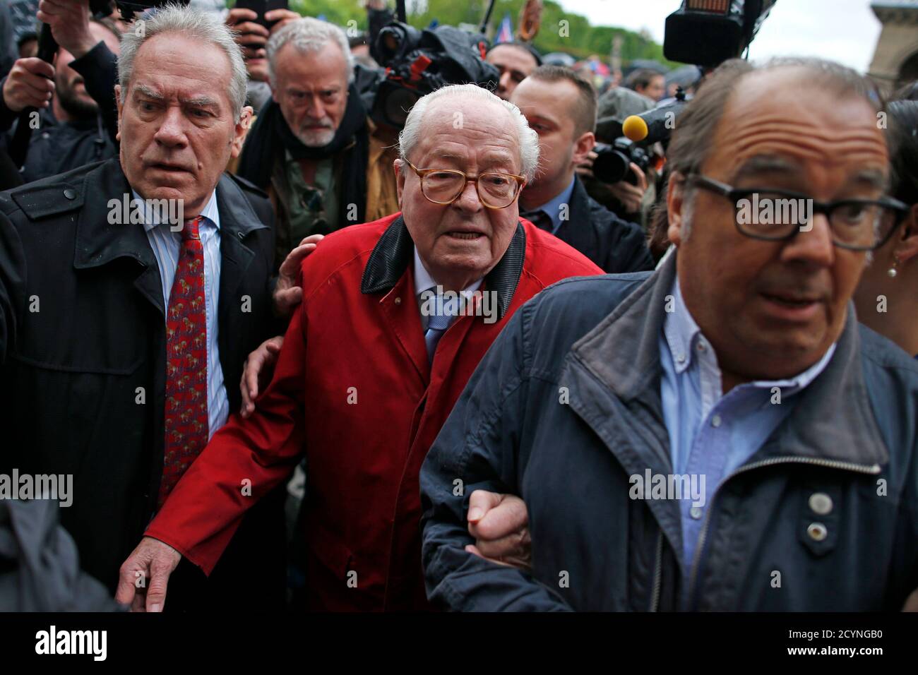 France's far-right National Front political party founder and honorary  president Jean-Marie Le Pen (C) and Jean-Michel Dubois (L) attend their  traditional May Day tribute to Joan of Arc in Paris, France, May