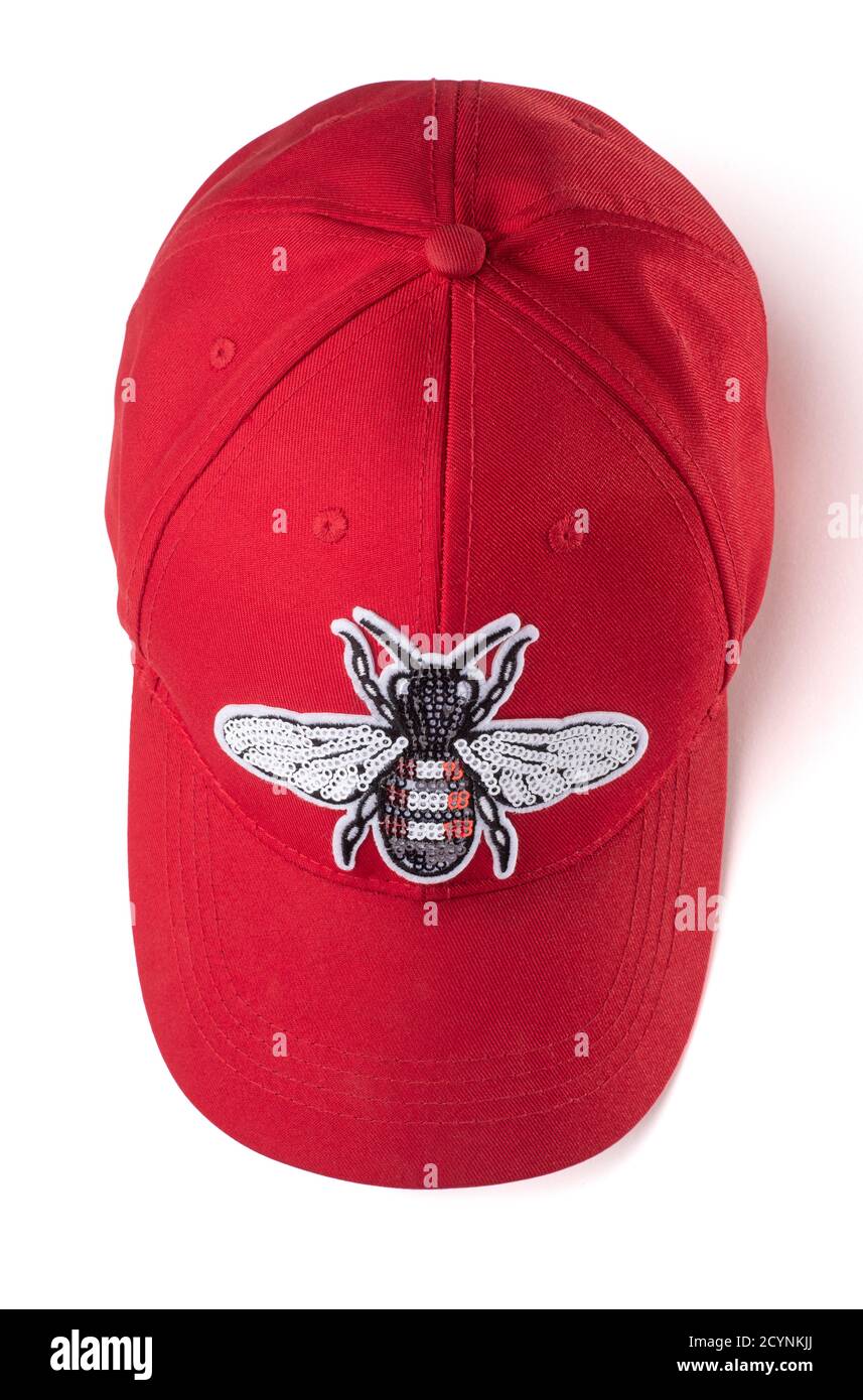 Red cap with a sequin fly patch on it 