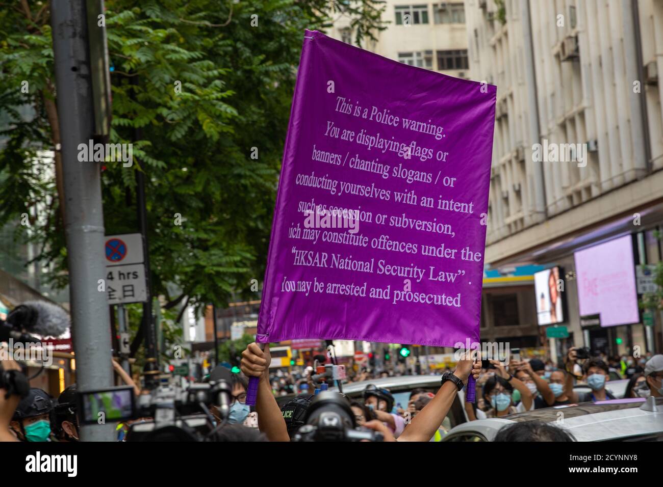 Hong Kong, Hong Kong. 01st Oct, 2020. Hong Kong Pro Democracy protesters took to the streets on China's National Day police raise a purple banner indicating that the people gathered are in breach of the national security law, in Hong Kong Hong Kong, S.A.R., October 01, 2020. Hong Kong National Security Law was imposed in July and Elections suspended (Photo by Simon Jankowski/Sipa USA) Credit: Sipa USA/Alamy Live News Stock Photo