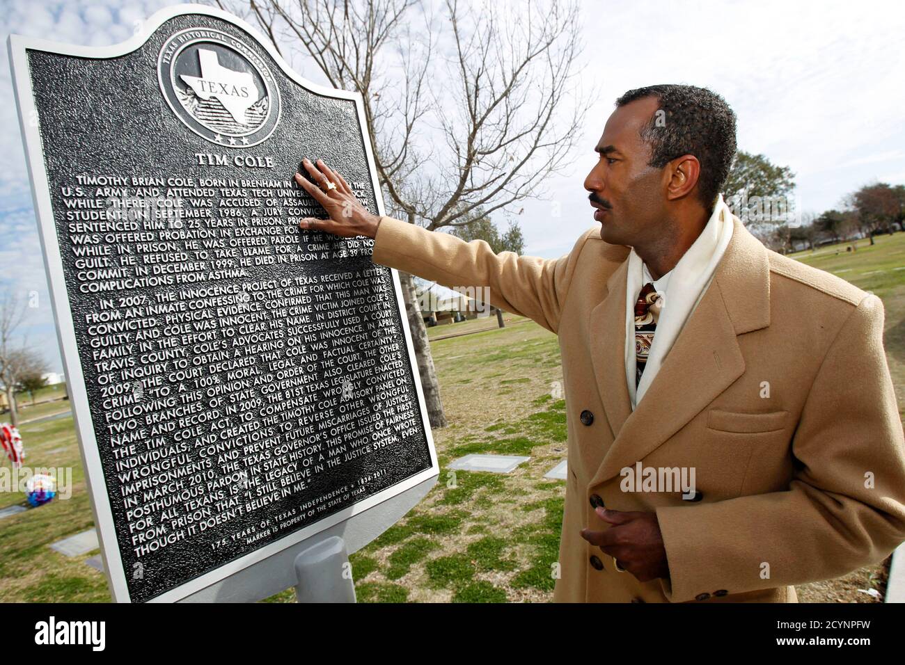 Cory Session, the brother of Tim Cole, the first person in the United  States to be exonerated posthumously on DNA evidence places his hand on a  newly erected historical marker dedicated to