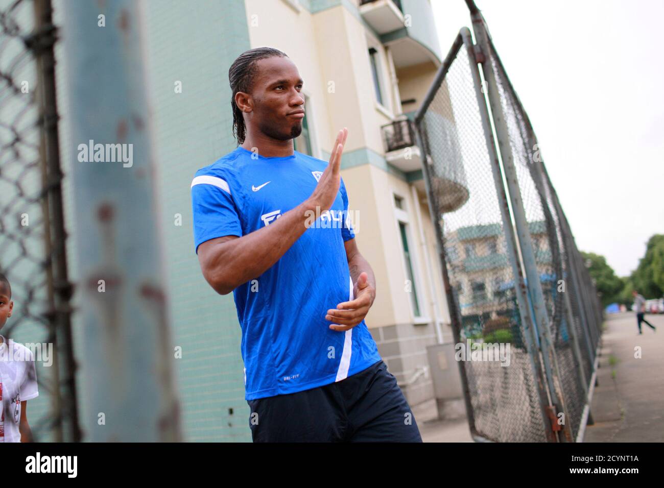 Shanghai Shenhua striker Didier Drogba of Ivory Coast attends a training session in Shanghai July 16, 2012. Drogba has signed a two-and-a-half-year contract with the big-spending Chinese Super League club for a reported salary of $300,000 a week, ending weeks of speculation on his future after he announced his decision to leave Champions League winners Chelsea. REUTERS/Aly Song (CHINA - Tags: SPORT SOCCER) Stock Photo