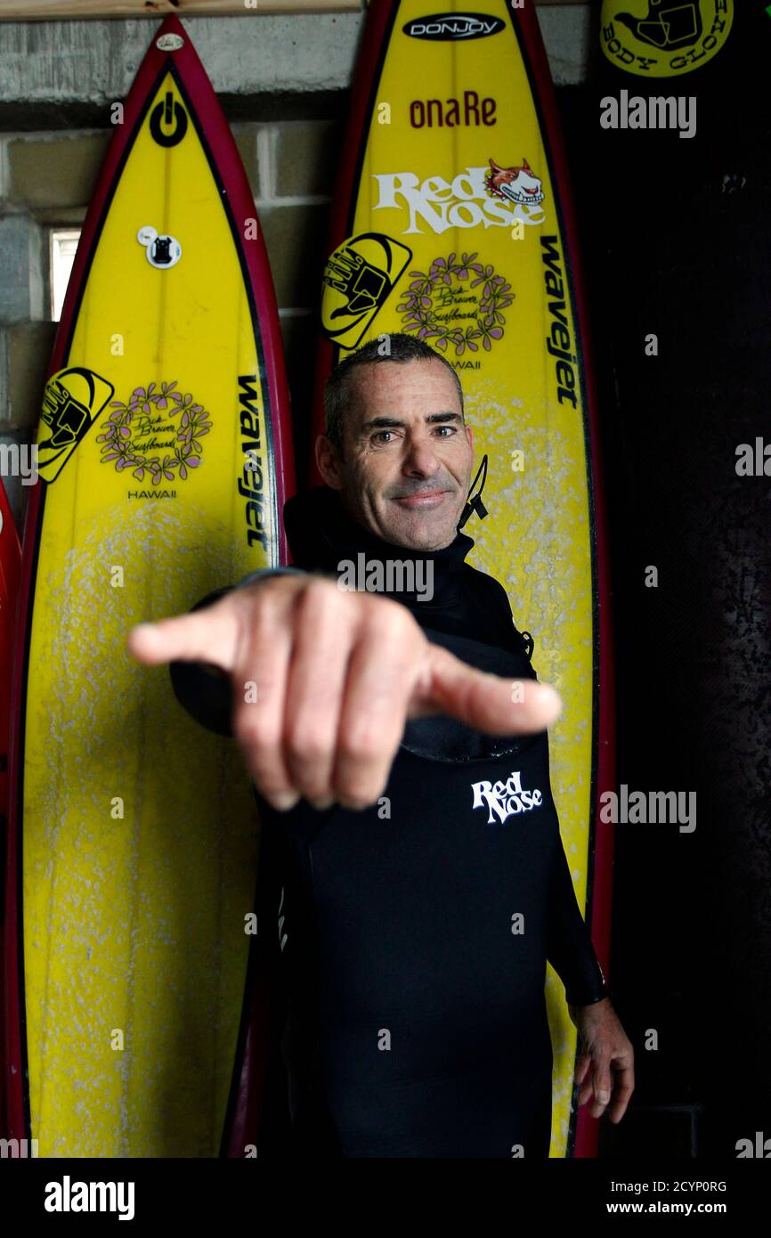 Changeable Credential Etna Big-wave surfer Garrett McNamara of the U.S. poses after surfing at Praia  do Norte in Nazare February 12, 2014. McNamara, 46, has had countless  experiences like that scouring the world for the