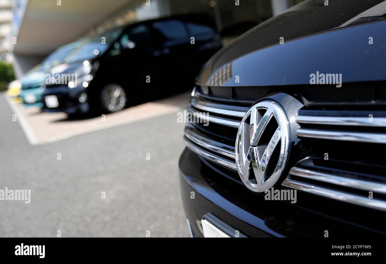 A Volkswagen Car R Is Seen In Front Of Toyota Motor Corp Cars At Their Dealership In Tokyo July 30 2014 Volkswagen Is Closing In On Toyota Motor Corp As The Global