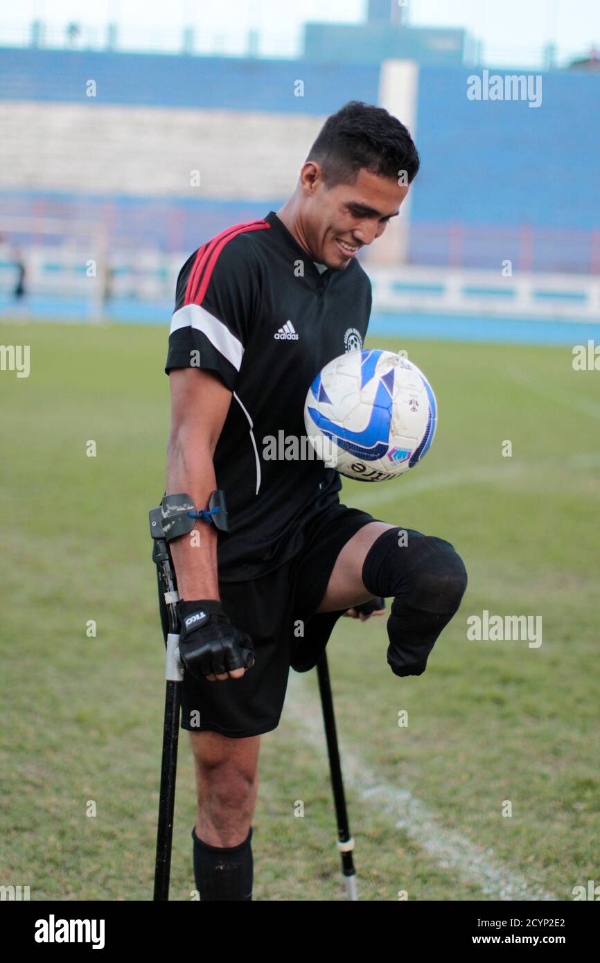 Jonathan Mendoza, a member of the Salvadorean national amputee soccer team,  controls the ball during a training session at Jorge "Magico" Gonzalez  National Stadium in San Salvador November 20, 2014. The El