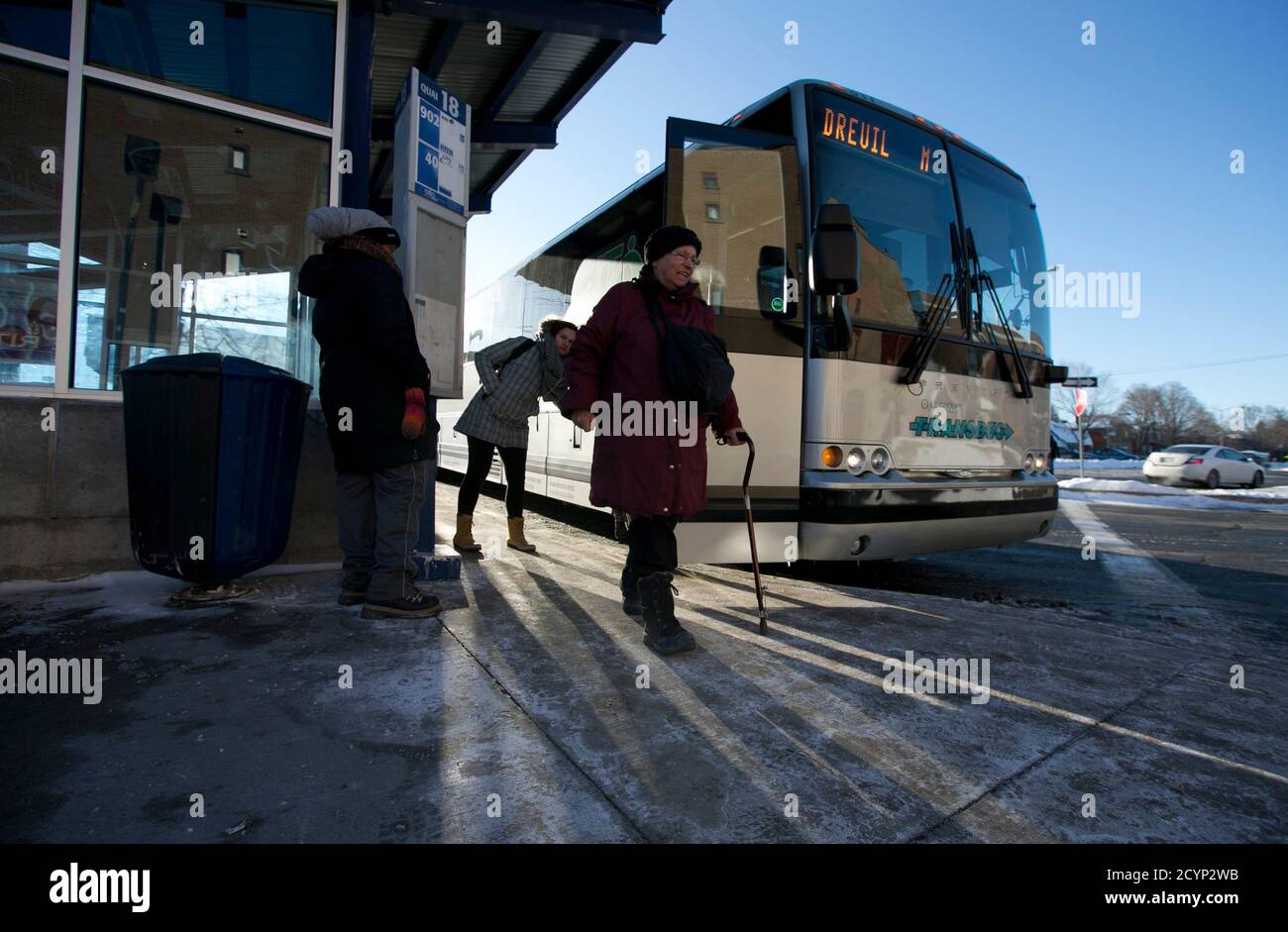 Commuters arrive by special bus from the Vaudreuil-Dorion train station to a metro line at Cote Vertu in Montreal, Quebec, February 16, 2015. A CP Rail strike left thousands of commuters from three major AMT commuter lines looking for alternate ways to get to work in downtown Montreal.  Canadian Pacific Railway Ltd began operating a reduced freight schedule run by its managers on Sunday, after talks on a new contract broke down and more than 3,000 train engineers and conductors walked off the job. Canada's No. 2 railway and the Teamsters Canada Rail Conference failed to agree on terms includin Stock Photo