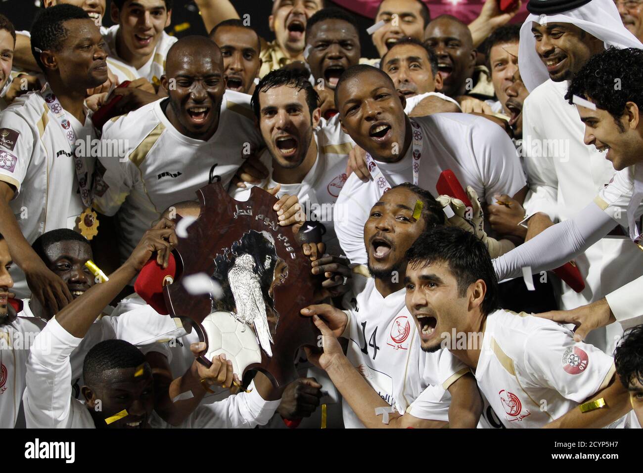 Lekhwia S Players Celebrate With The League Trophy After Winning After Their Qatar Stars League Soccer Match Against Umm Salal In Doha April 8 11 Reuters Fadi Al Assaad Qatar s Sport Soccer Stock