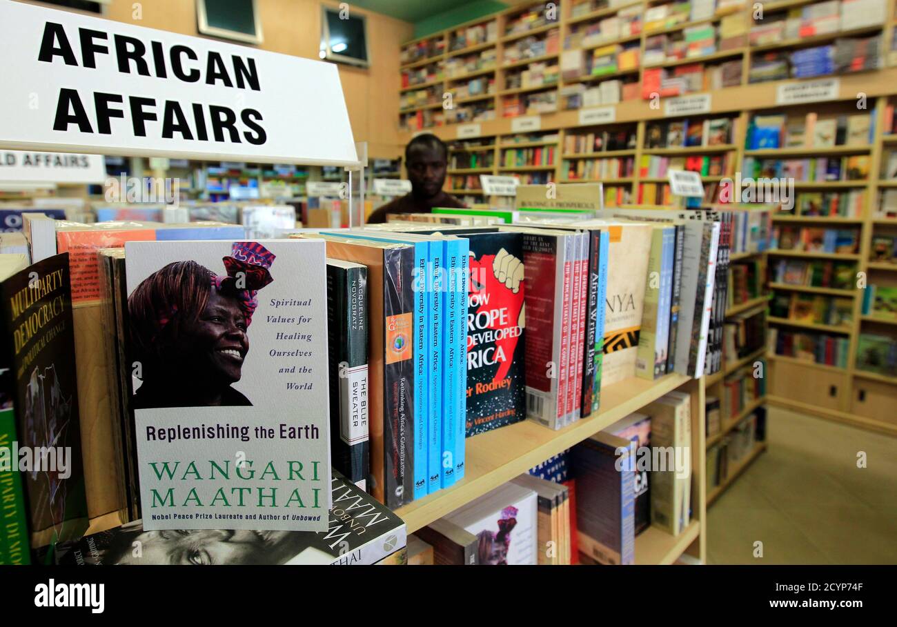 A biography of Wangari Maathai is seen inside a bookshop in Kenya's capital Nairobi, September 26, 2011. Maathai, the first African woman to win the Nobel Peace Prize for her campaigns to save Kenyan forests, died in hospital on Sunday after a long struggle with ovarian cancer. Maathai, 71, founded the Green Belt Movement in 1977 to plant trees to prevent environmental and social conditions deteriorating and hurting poor people, especially women, living in rural Kenya. REUTERS/Thomas Mukoya (KENYA - Tags: PROFILE SOCIETY OBITUARY POLITICS) Stock Photo