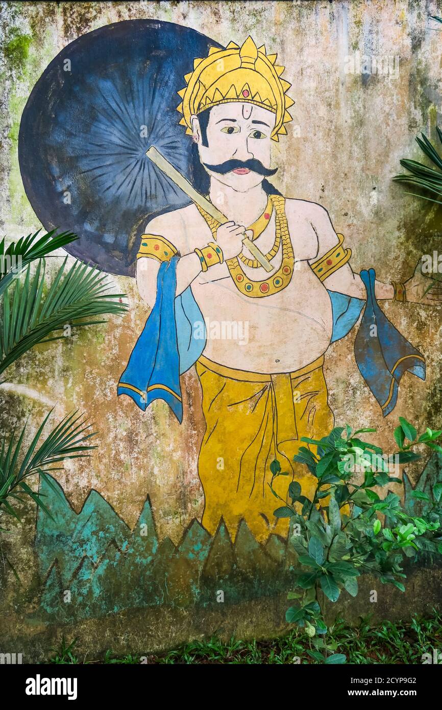 Colourful aged mural of man with towels at the Dhobi Khana, a rare old