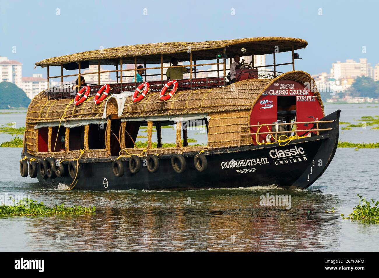 Tourist houseboat style sightseeing boat on Vembanad Lake between Fort Cochin and Fort Vypin; Vembanad Lake, Kochi (Cochin), Kerala, India Stock Photo