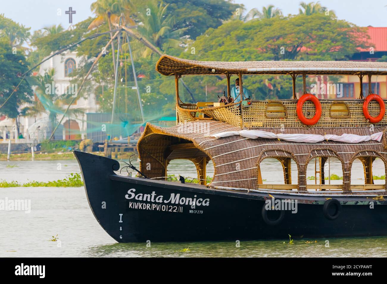 Tourist houseboat style sightseeing boat on Vembanad Lake between Fort Cochin and Fort Vypin; Vembanad Lake, Kochi (Cochin), Kerala, India Stock Photo
