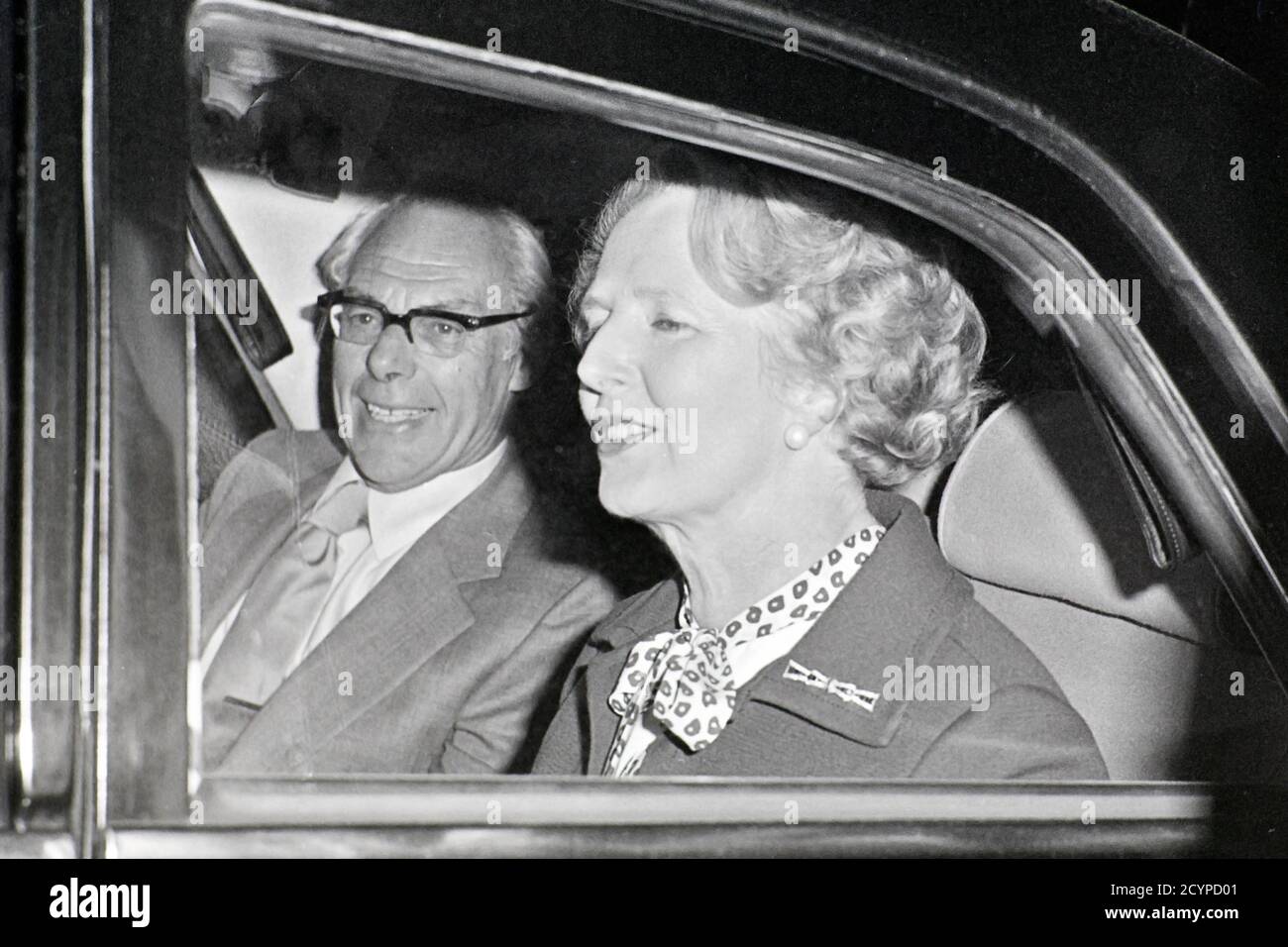 Prime Minister Margaret Thatcher arriving at London Heathrow airport August 1979 with her husband Denis Thatcher Stock Photo