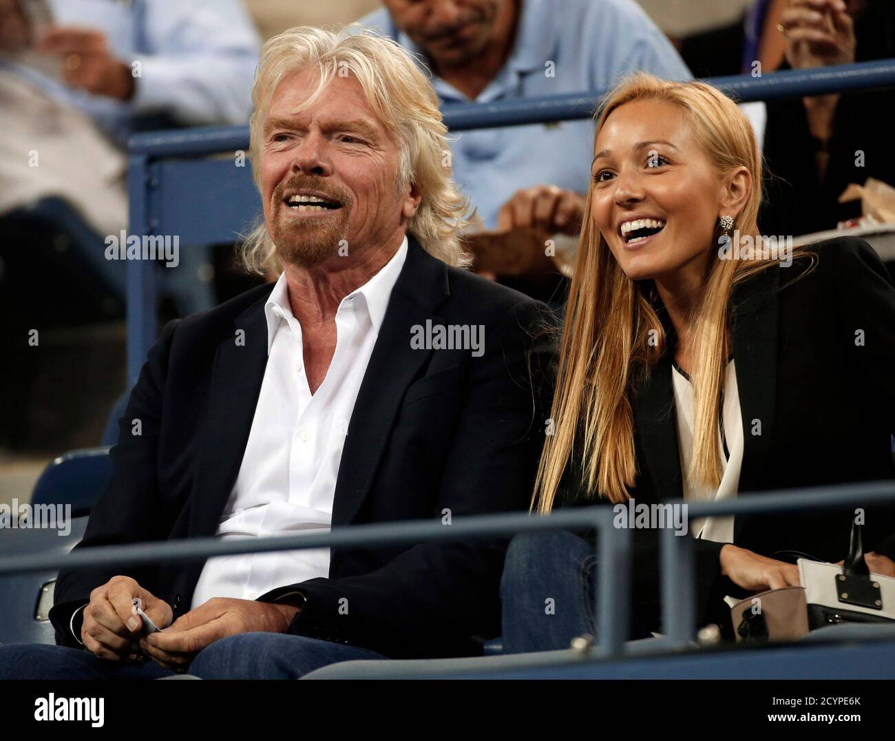 Virgin Group Founder Richard Branson Of Britain Sits With Jelena Ristic Girlfriend Of Serbian Tennis Player Novak Djokovic At The U S Open Tennis Championships In New York September 5 2013 Reuters Mike Segar