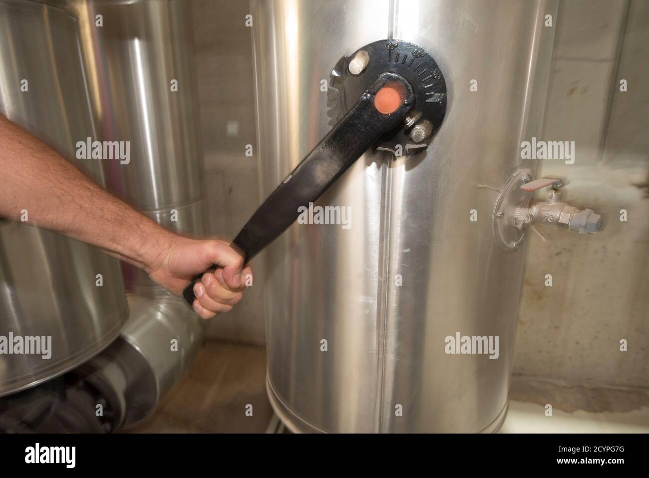 manual opening or closing a valve in an industrial plant Stock Photo ...