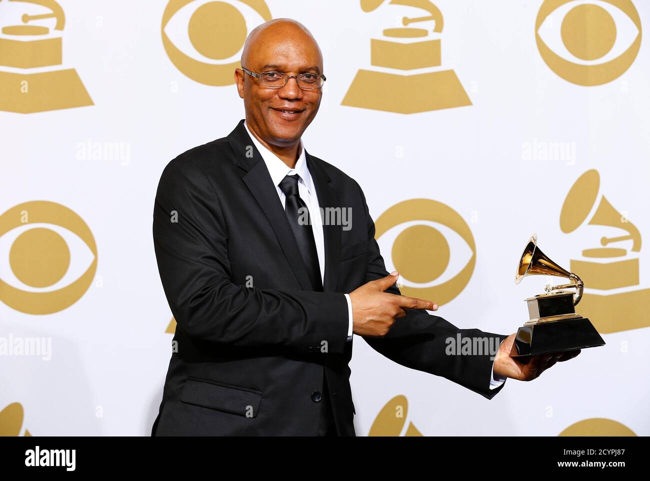 Billy Childs poses with his award for best arraignment, instrument and vocals for 'New York Tendaberry' backstage at the 57th annual Grammy Awards in Los Angeles, California February 8, 2015.   REUTERS/Mike Blake (UNITED STATES  - Tags: ENTERTAINMENT)  (GRAMMYS-BACKSTAGE) Stock Photo