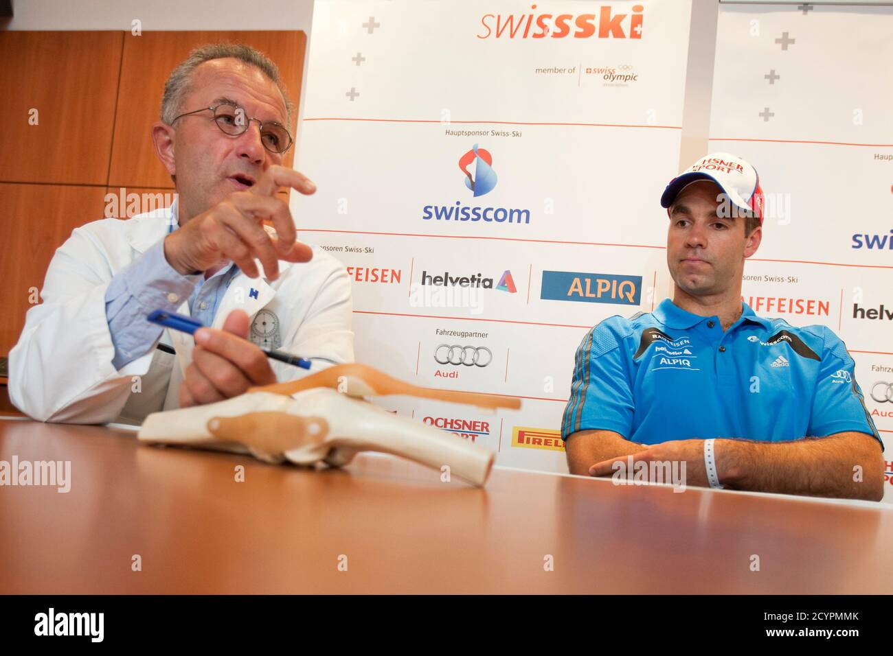 Doctor Olivier Siegrist (L) discusses the operation of Olympic downhill  skiing champion Didier Defago at a press conference at the Hopital de la  Tour in Meyrin, near Geneva, September 19, 2010. Defago