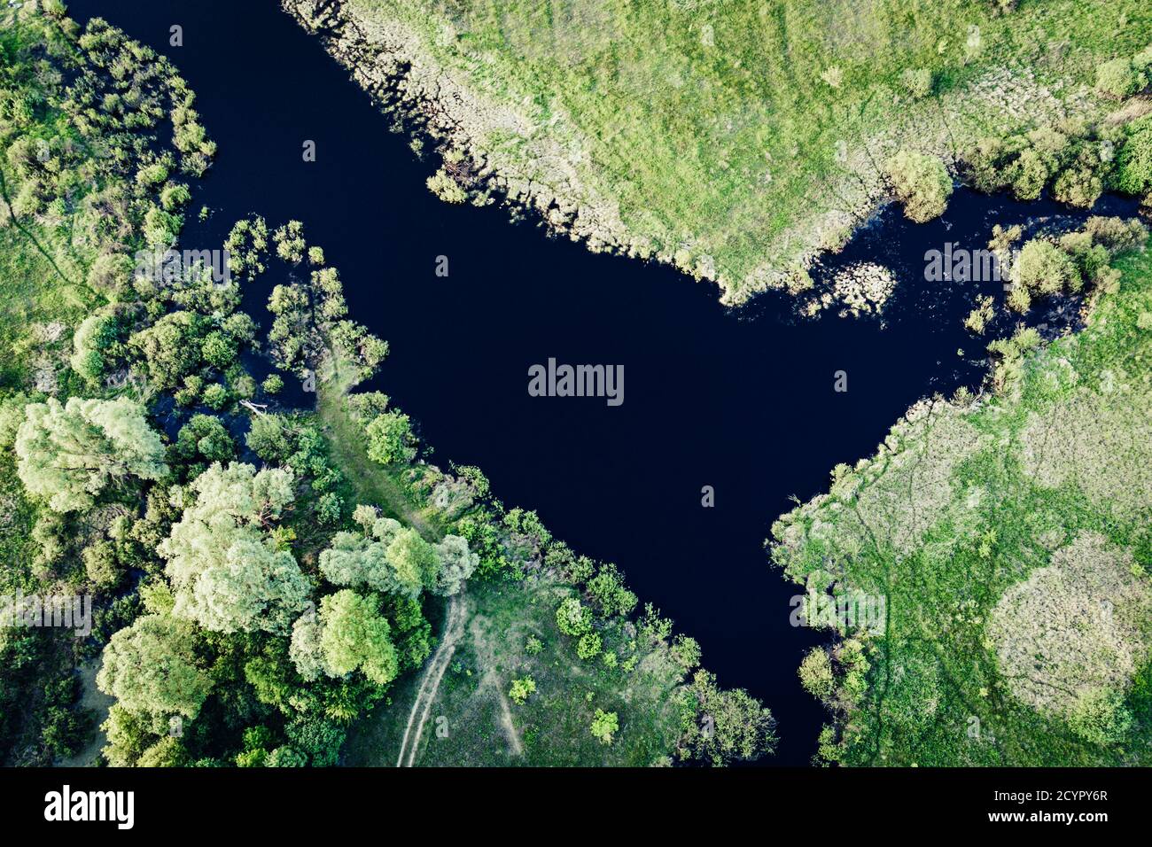 Aerial landscape of blue lake in green field, top view of beautiful ...