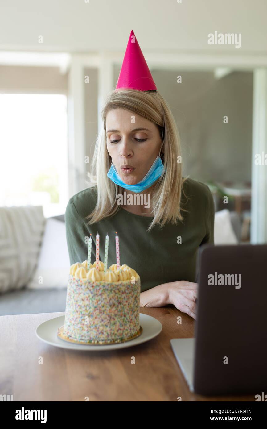 Beaming Smiling Woman Spending Time In Strange Posture Stock Photo