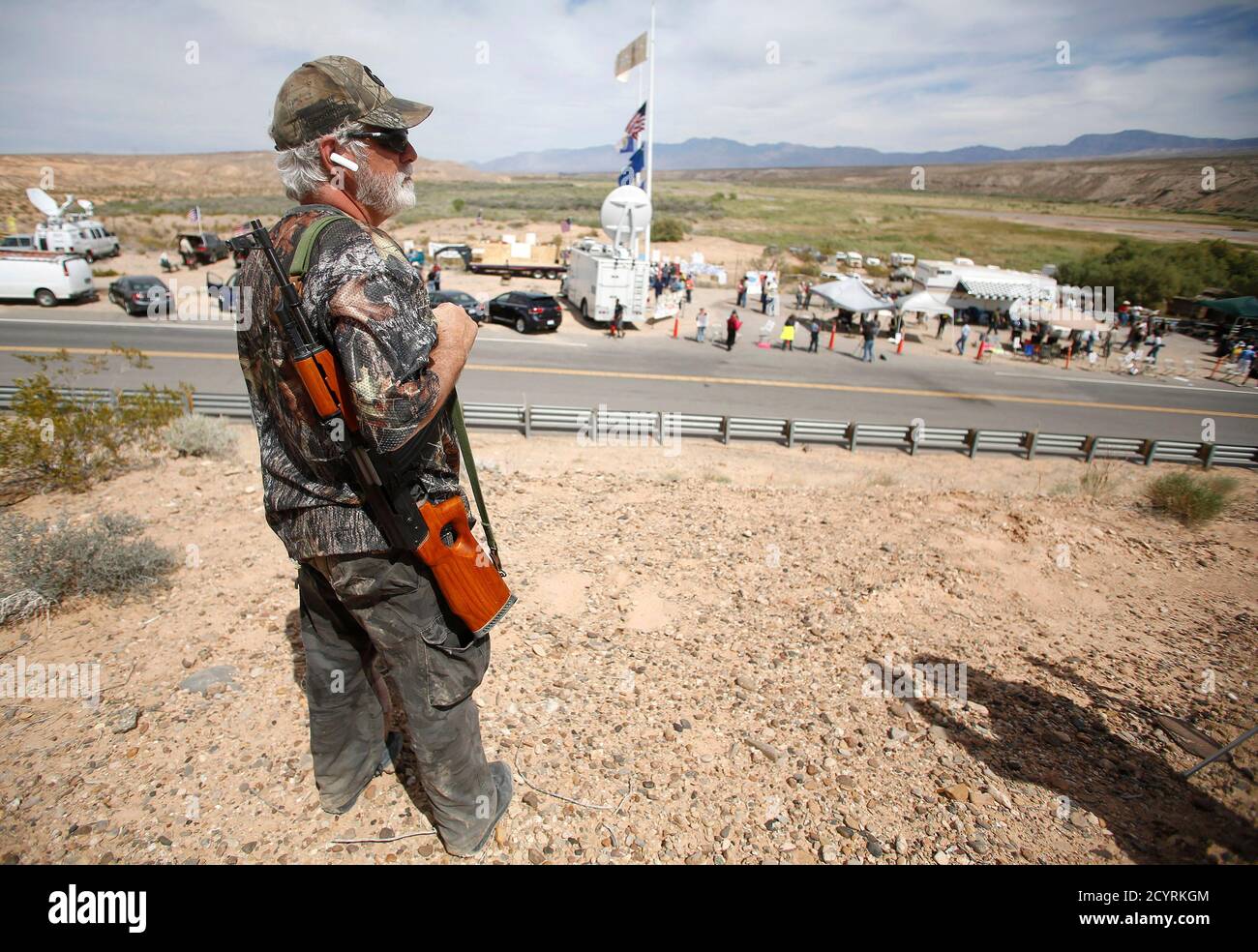 Brand Thornton, a member of the Southern Nevada Militia, carries a rifle  while at a protest site in Bunkerville, Nevada, April 11, 2014. Armed U.S.  rangers are rounding up cattle on federal