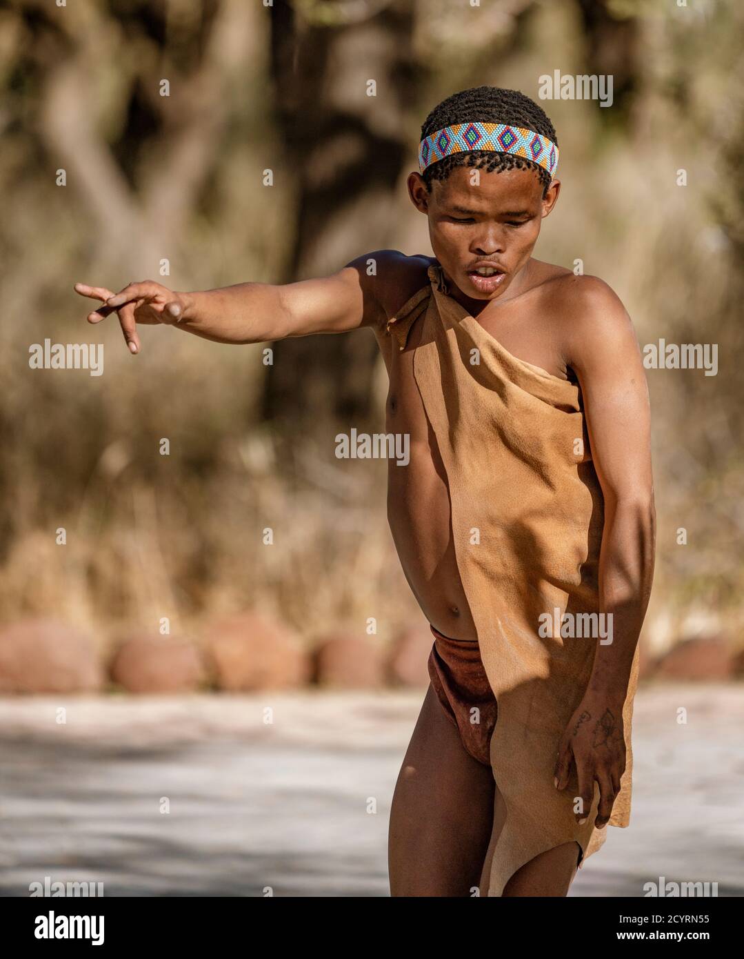 Erindi, Namibia - July 19, 2018: A native bushman gives a farewell dance to wish good hunting to the photographers in Botswana Stock Photo