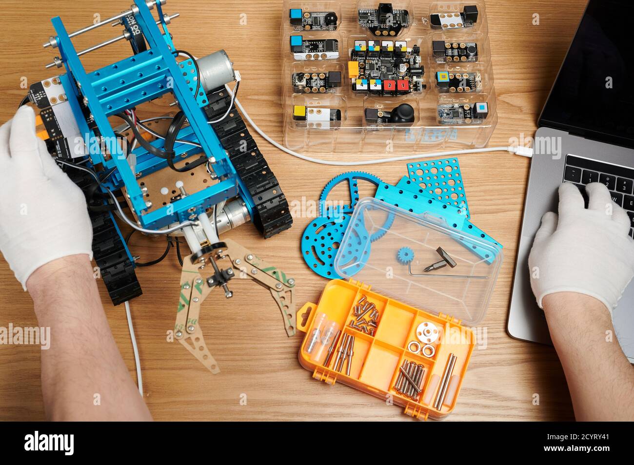 Stem school theme. Student programming robot bot with laptop Stock ...