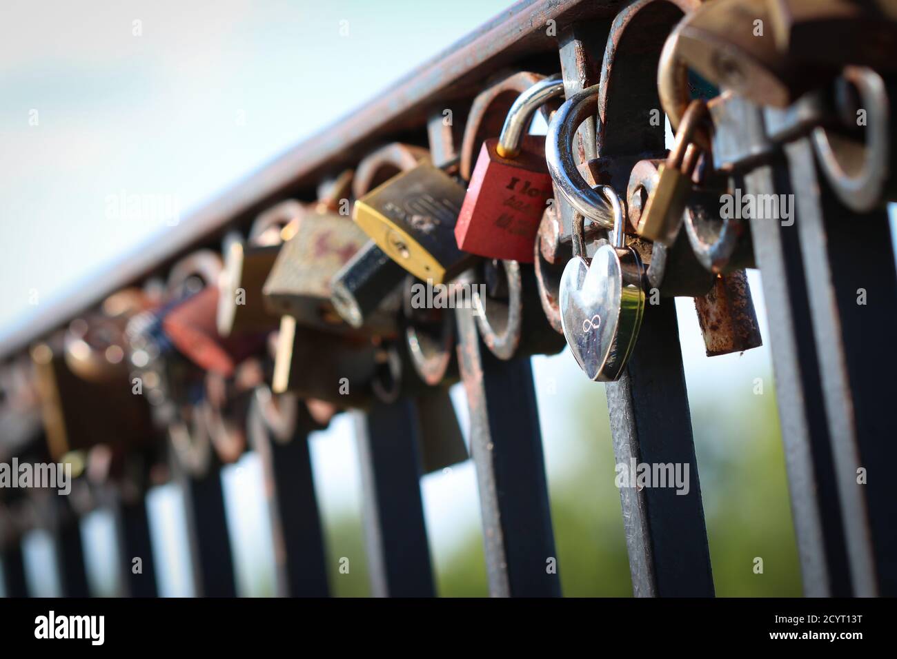 Love padlocks attached to the railing in Warsaw, Poland Stock Photo