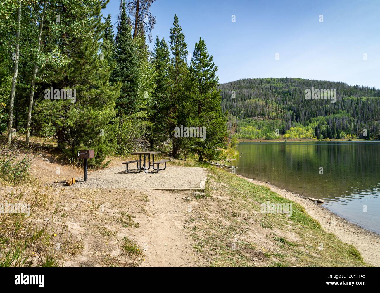 An empty picnic area by the beautiful, calm, Pearl Lake State Park in Clark, Colorado Stock Photo