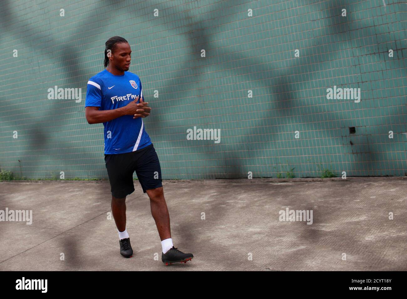 Shanghai Shenhua striker Didier Drogba of Ivory Coast attends a training session in Shanghai July 16, 2012. Drogba has signed a two-and-a-half-year contract with the big-spending Chinese Super League club for a reported salary of $300,000 a week, ending weeks of speculation on his future after he announced his decision to leave Champions League winners Chelsea. REUTERS/Aly Song (CHINA - Tags: SPORT SOCCER) Stock Photo