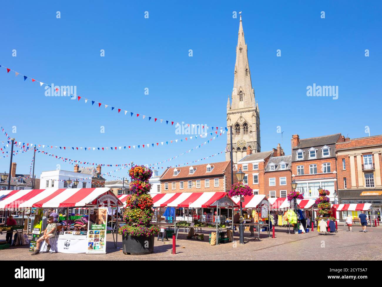 Newark market and Church of St. Mary Magadalene behind the Newark Royal market in the Market Place Newark-on-Trent Nottinghamshire UK GB Europe Stock Photo