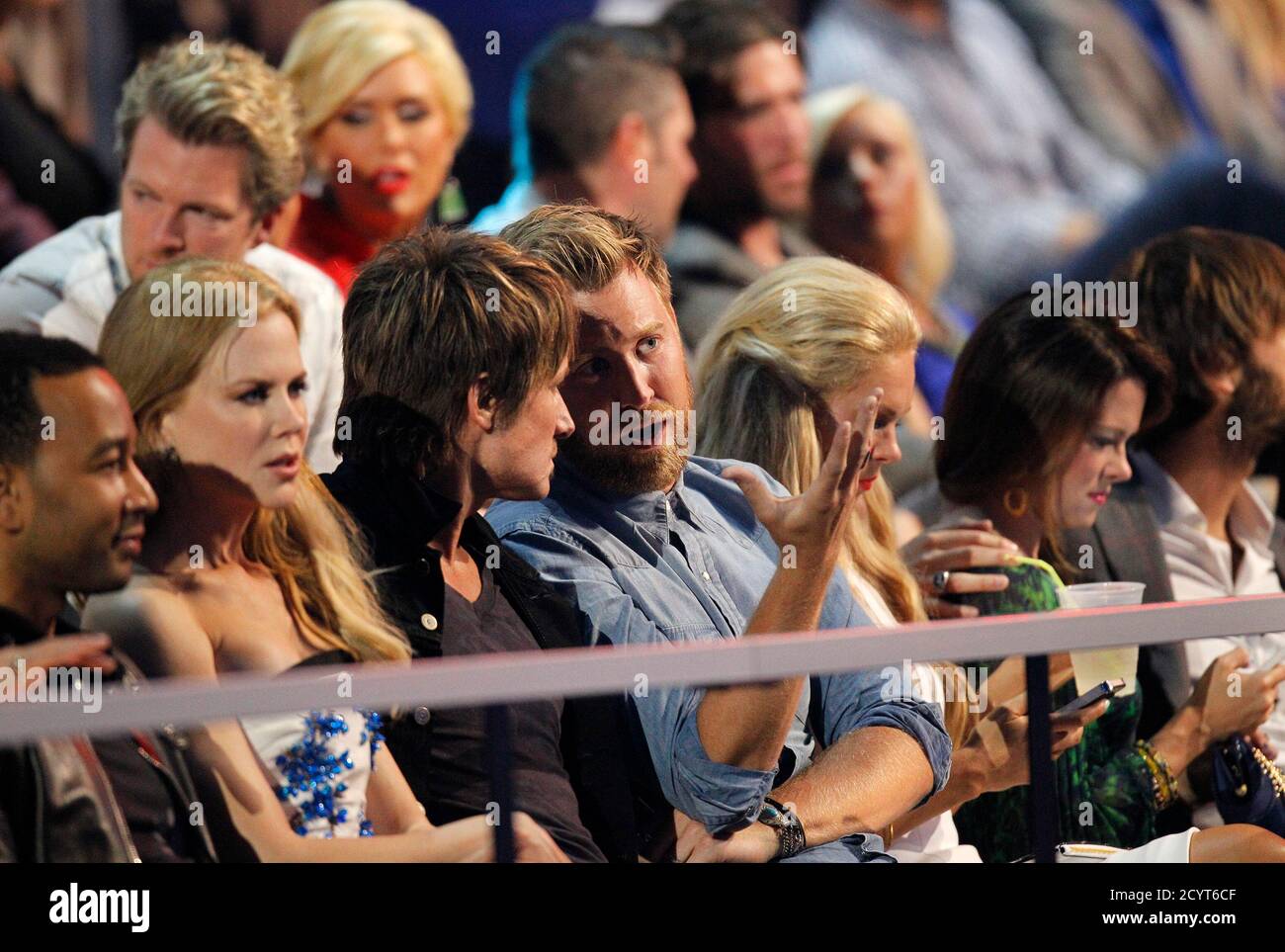 Musicians Charles Kelley (R) and Keith Urban chat in the audience as Urban's wife, actress Nicole Kidman, watches the show during the 2014 CMT Music Awards in Nashville, Tennessee June 4, 2014.   REUTERS/Harrison McClary (UNITED STATES  - Tags: ENTERTAINMENT) Stock Photo