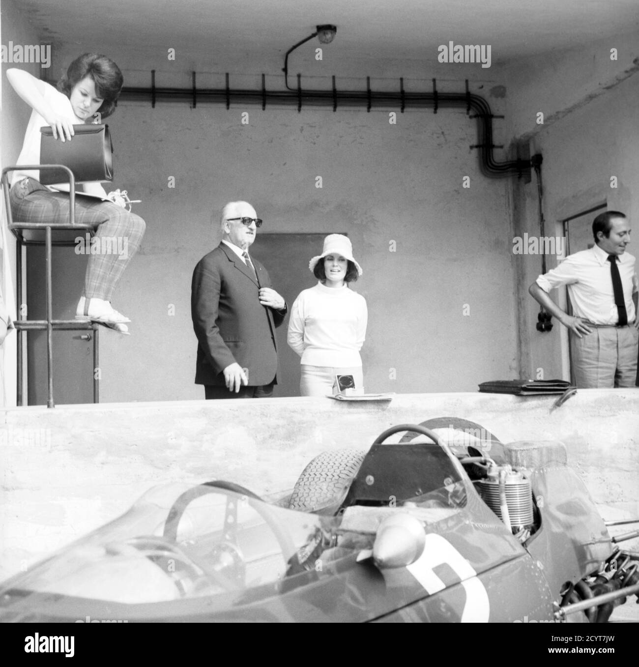 Enzo Ferrari; in the foreground, John Surtees' Ferrari 158, Italian Grand Prix, Monza, National Circuit, 6 September 1964. --- Enzo Ferrari; in primo piano, la Ferrari 158 di John Surtees, Gran Premio d'Italia, Monza, Autodromo nazionale, 6 settembre 1964. Stock Photo