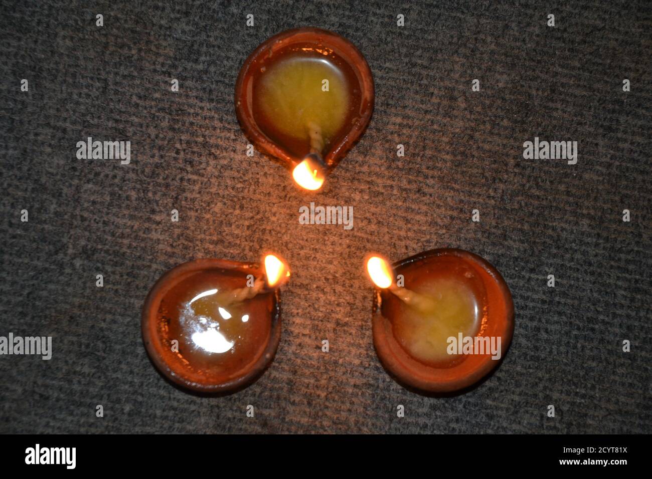 Oil lamps with flame. deepawali or diwali is celebrated by hindus by lighting the oil lamps