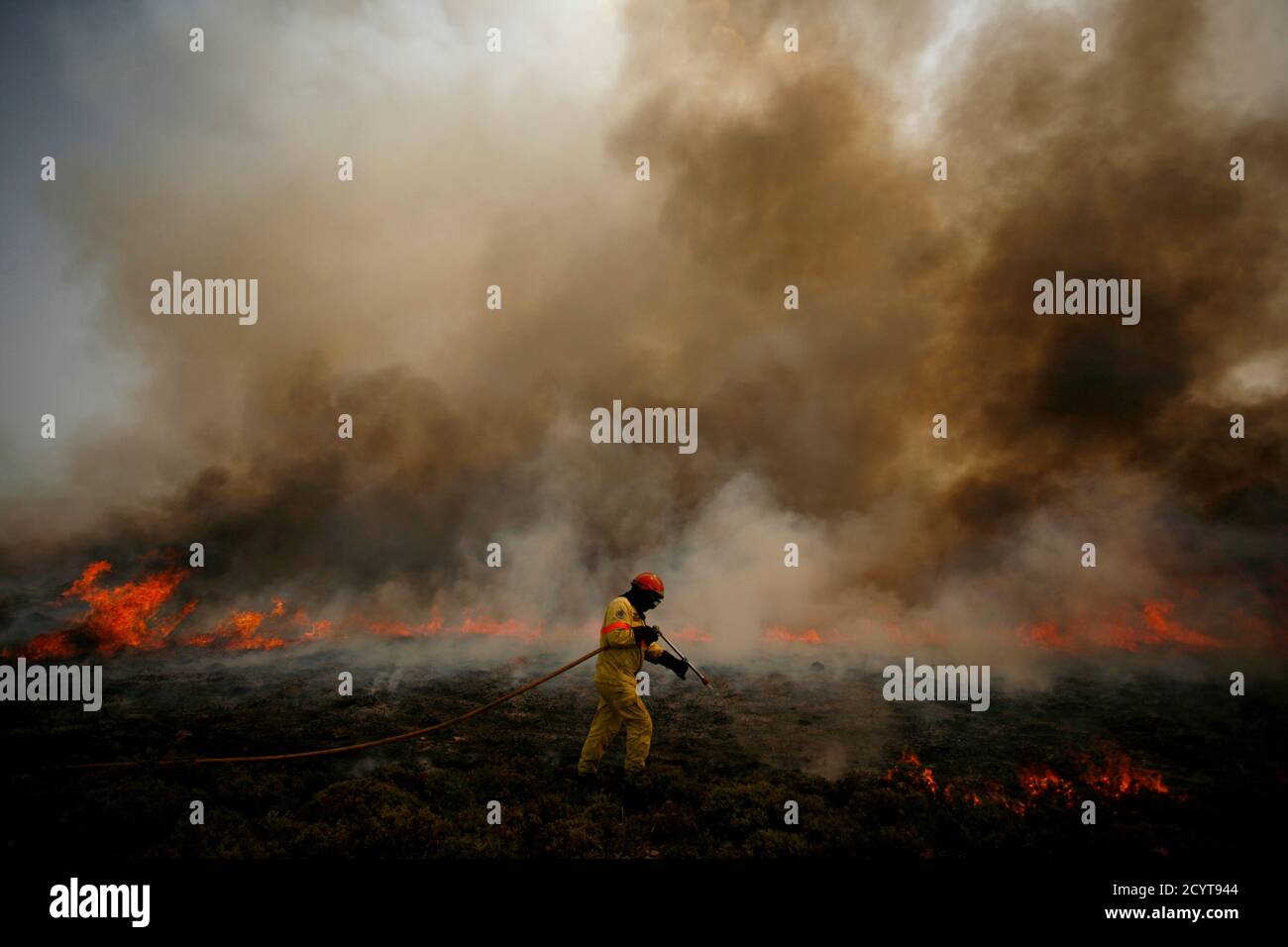 A Firefighter Attempts To Extinguish A Fire Burning At Arada Mountains Near Sao Pedro Do Sul August 9 10 More Than 700 Firefighters And Soldiers Are Trying To Extinguish Dozens Of Forest A Firefighter Attempts To Extinguish A Fire Burning At Arada Mountains Near Sao Pedro Do Sul August 9 10 More Than 700 Firefighters And Soldiers Are Trying To Extinguish Dozens Of Forest