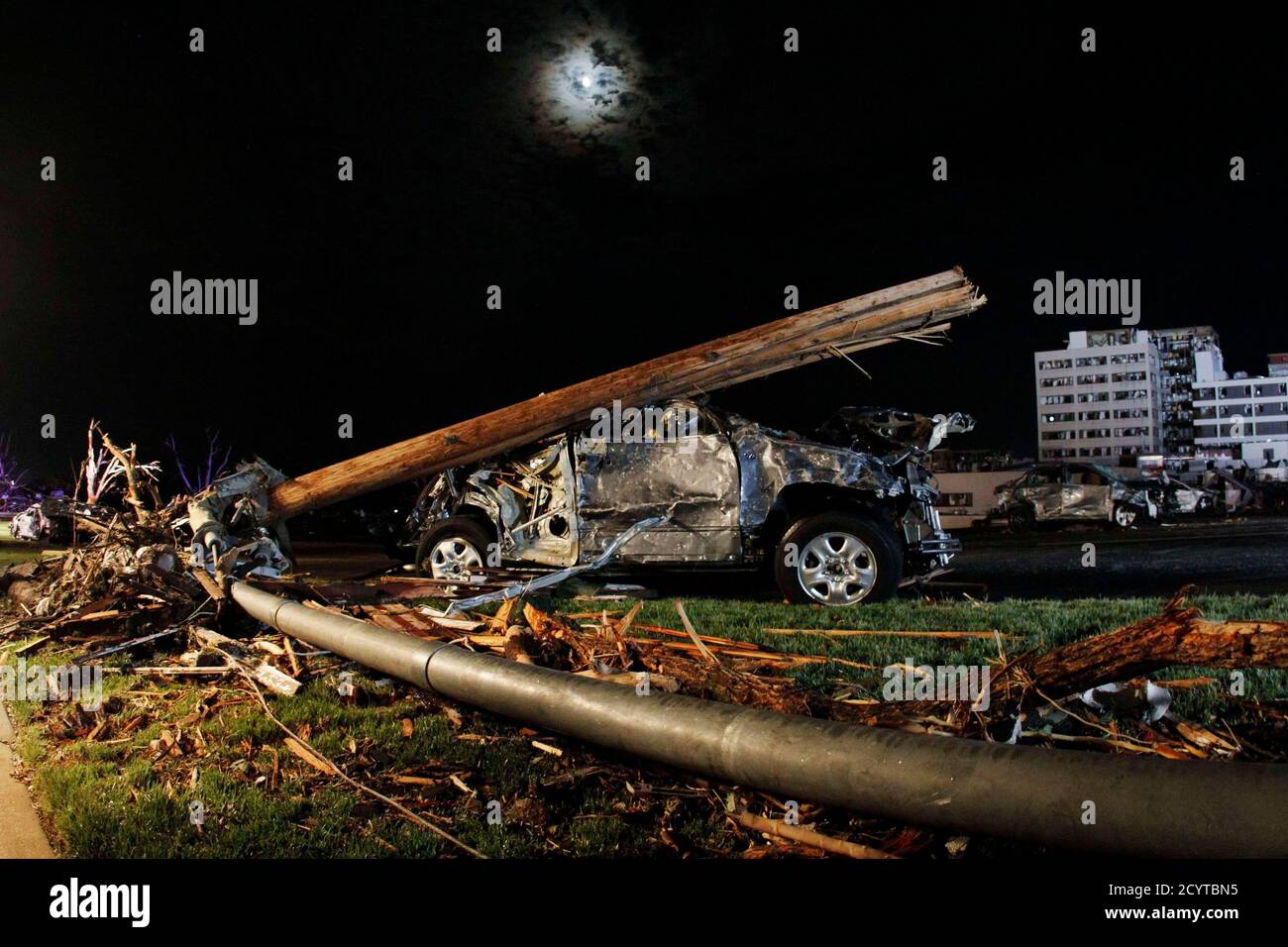 a-damaged-car-is-pictured-in-the-parking-lot-of-st-johns-regional-medical-center-after-a-tornado-swept-through-joplin-missouri-may-22-2011-at-least-89-people-have-died-in-a-monster-tornado-that-left-a-path-of-destruction-nearly-a-mile-1-km-wide-through-the-heart-of-joplin-missouri-and-directly-hit-the-small-midwestern-citys-main-hospital-local-officials-said-on-monday-picture-taken-may-22-reutersed-zurga-united-states-tags-environment-disaster-images-of-the-day-2CYTBN5.jpg