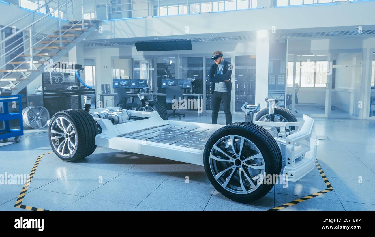 Automotive Engineer Working on Electric Car Chassis Platform, Using