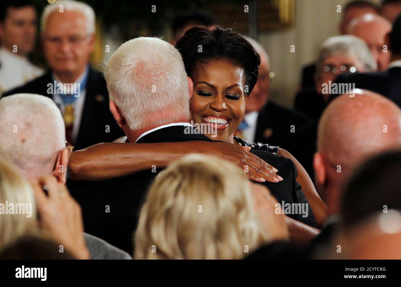 U S First Lady Michelle Obama Hugs Mike Meyer Father Of Dakota Meyer After Dakota Was Awarded The Medal Of Honor At The White House In Washington September 15 2011 Former Active Duty