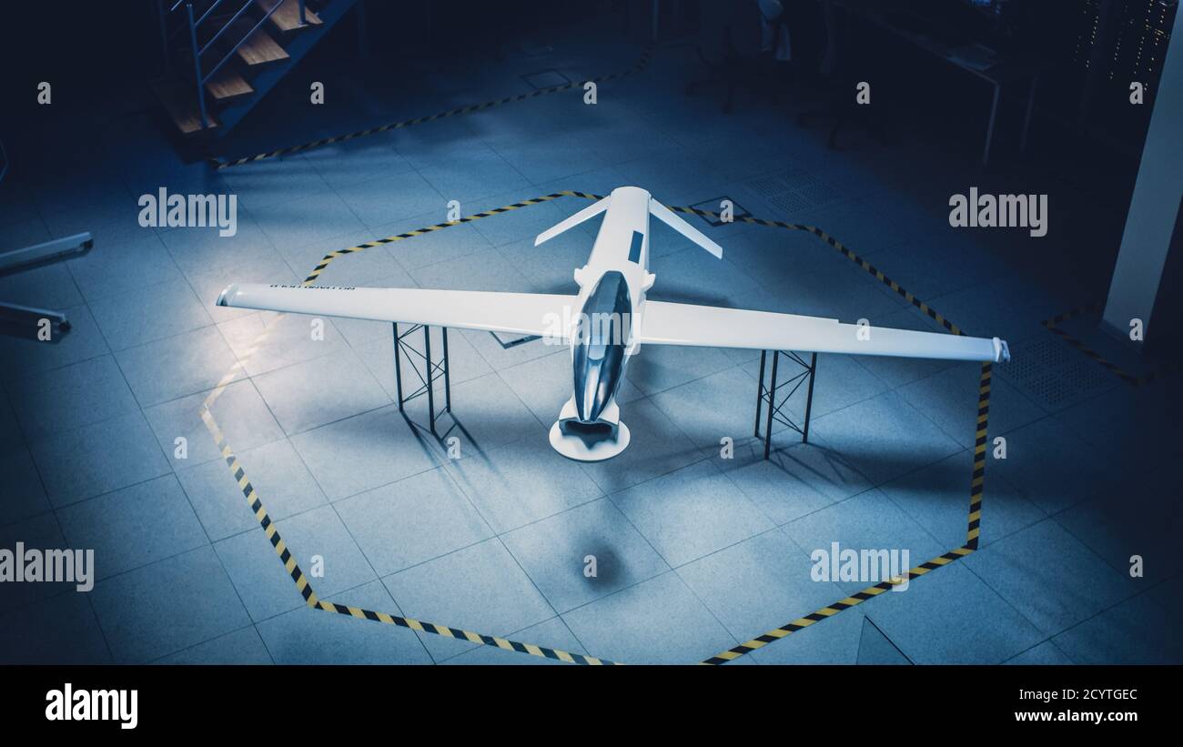 Elevated Shot of an Unmanned Aerial Vehicle Drone Prototype. Industrial Facility with Aircraft Capable of GPS Surveillance and Military Missions Stock Photo