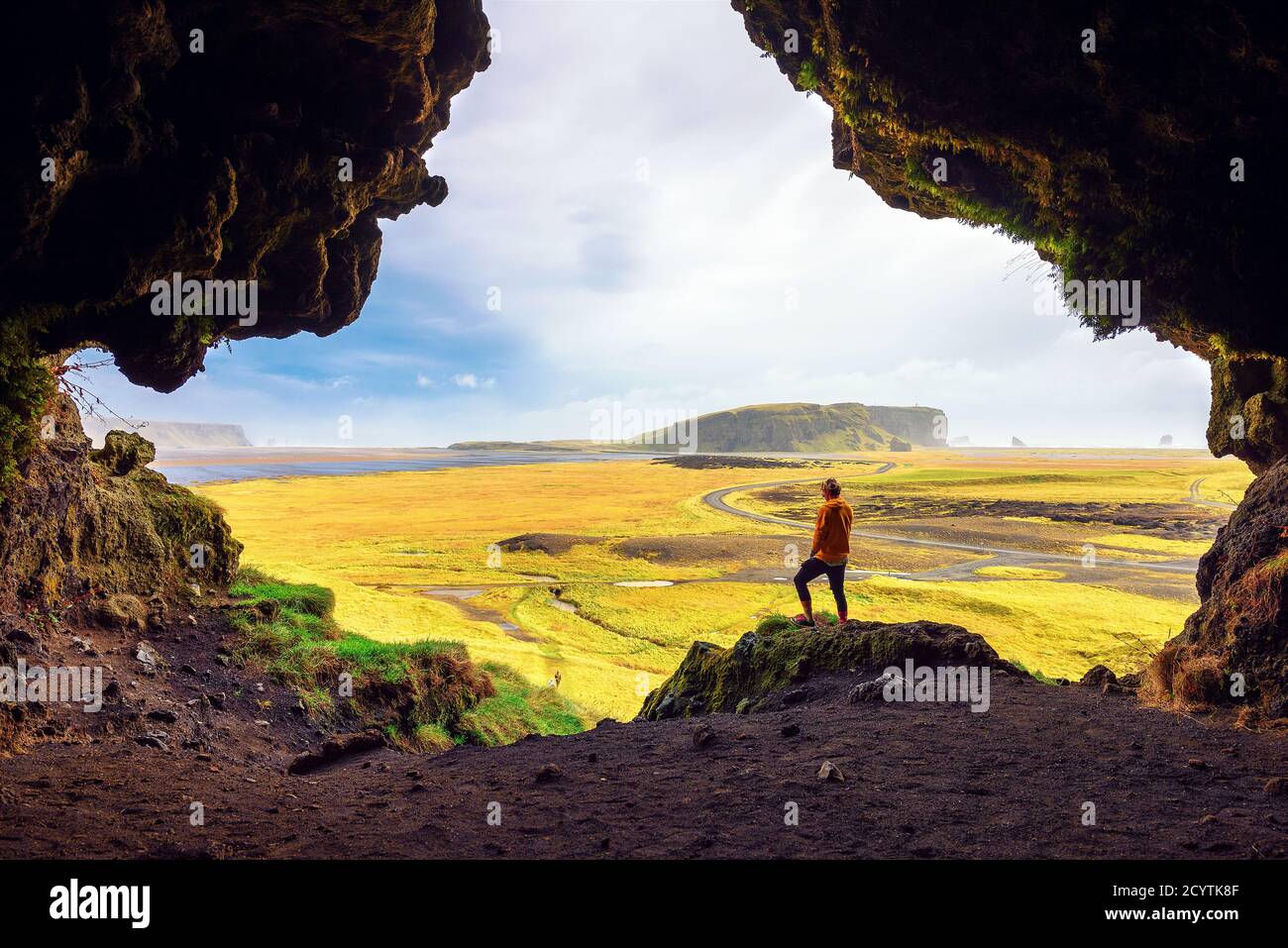 Hiker in the Loftsalahellir Cave near the village of Vik in Iceland Stock Photo