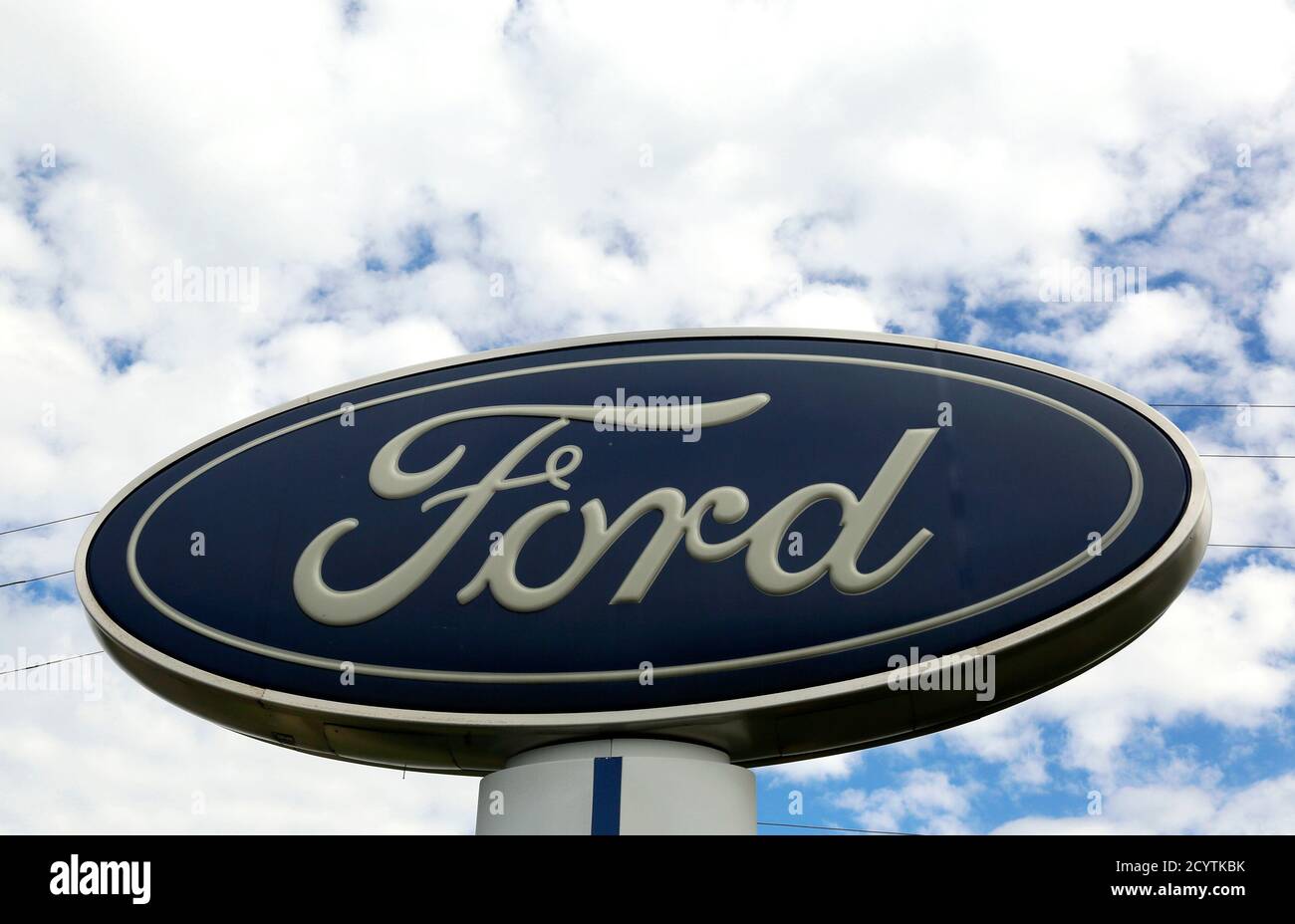 The sign at a Ford dealer is pictured in Lakewood, Colorado September 4, 2013. U.S. auto sales were on a pace to show a gain as high as 17 percent in August as the industry raced toward its strongest month since just before the start of the 2007-2009 recession.    REUTERS/Rick Wilking (UNITED STATES - Tags: BUSINESS TRANSPORT) Stock Photo