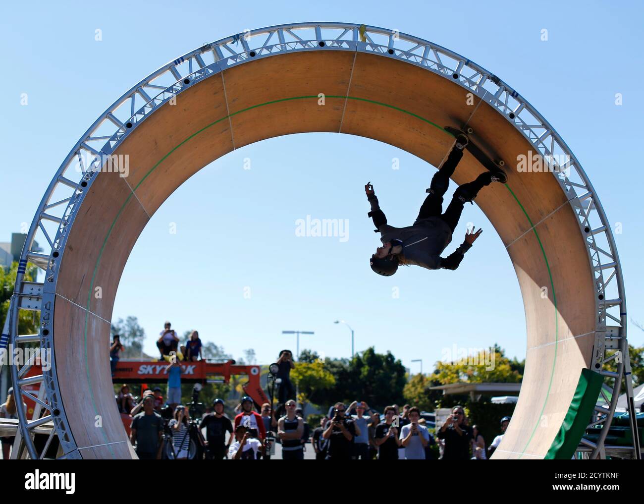 Skateboarder Aaron "Jaws" Homoki of Phoenix, Arizona manages to stay on his  board as he completes his attempt to ride a 15-foot (4.6-metre) high skateboard  loop in Vista, California October 20, 2013.