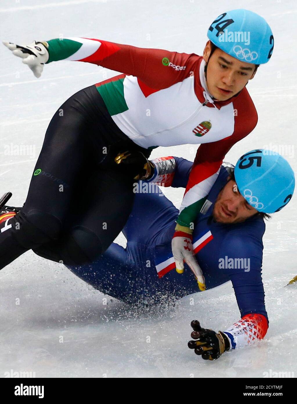 France's Thibaut Fauconnet collides with Hungary's Shaolin Liu (L) during  the men's 1,000 metres short track speed skating heats at the Iceberg  Skating Palace during the 2014 Sochi Winter Olympics February 13,