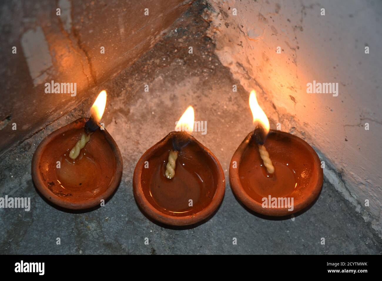 Oil lamps with flame. deepawali or diwali is celebrated by hindus by lighting the oil lamps. Stock Photo