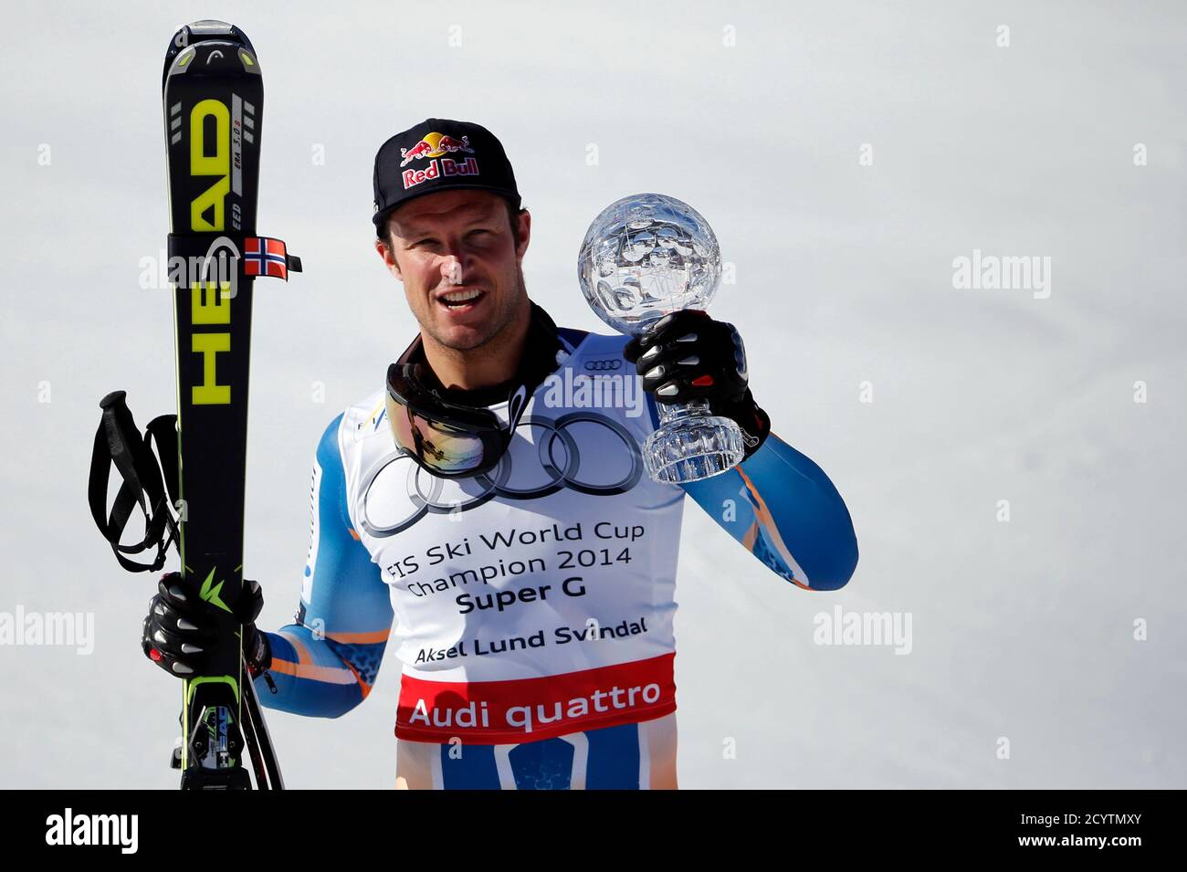 Overall winner Aksel Lund Svindal of Norway holds the trophy after the  men's Super G competition during the FIS Alpine Skiing World Cup finals in  the Swiss ski resort of Lenzerheide March