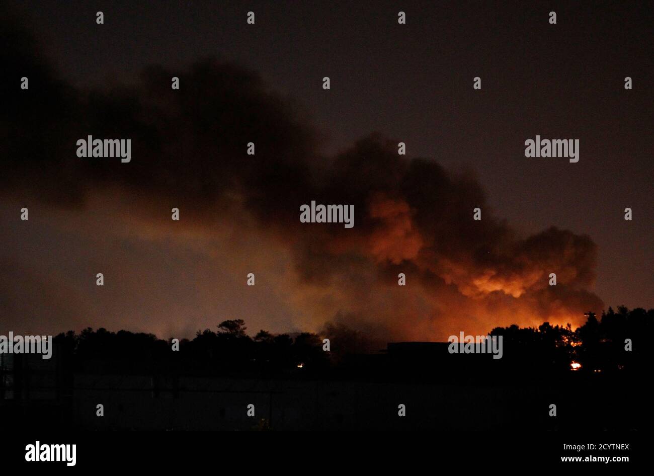 Fire flames smoke distance hires stock photography and images Alamy