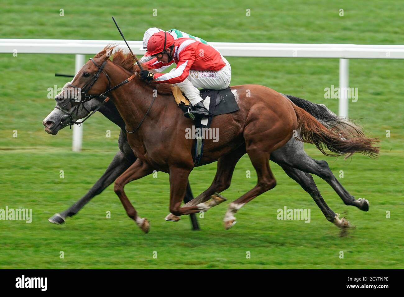 Oisin Murphy riding Berkshire Rocco (red) wins The TeenTech Noel Murless Stakes from Harry Bentley and Albaflora (farside) at Ascot Racecourse, Ascot. Stock Photo