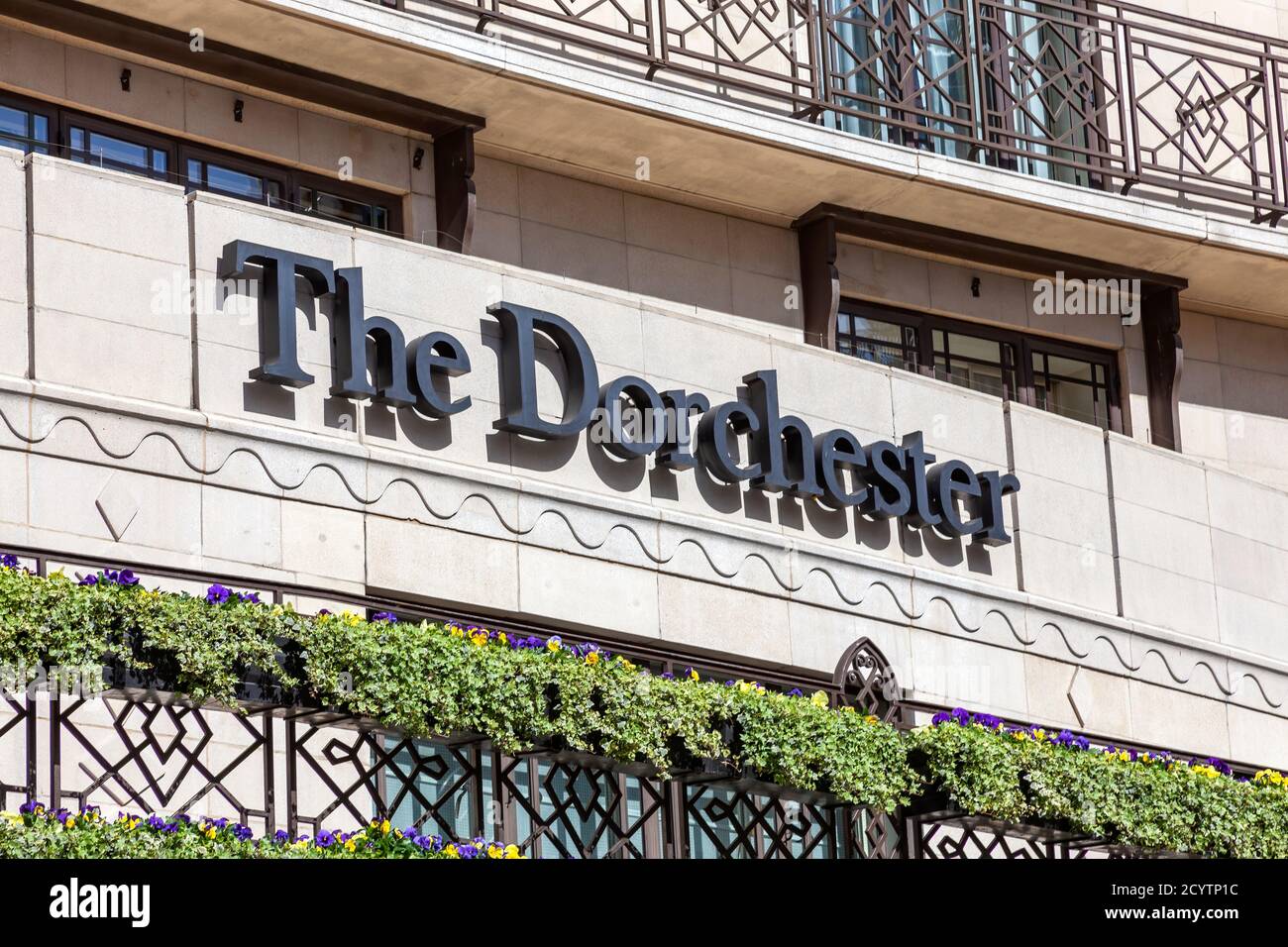 London, UK, April 1, 2012 : The Dorchester Hotel advertising logo sign outside its hotel in Park Lane Mayfair Hyde Park which is a popular travel dest Stock Photo