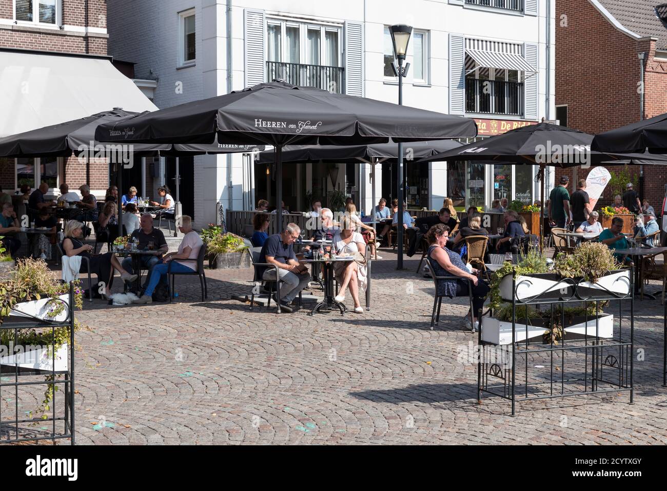 Gemert,Netherlands,13-sep-2020: People enjoy drinks on a cafe terrace on the Grote Markt square in the center of Gemert Stock Photo