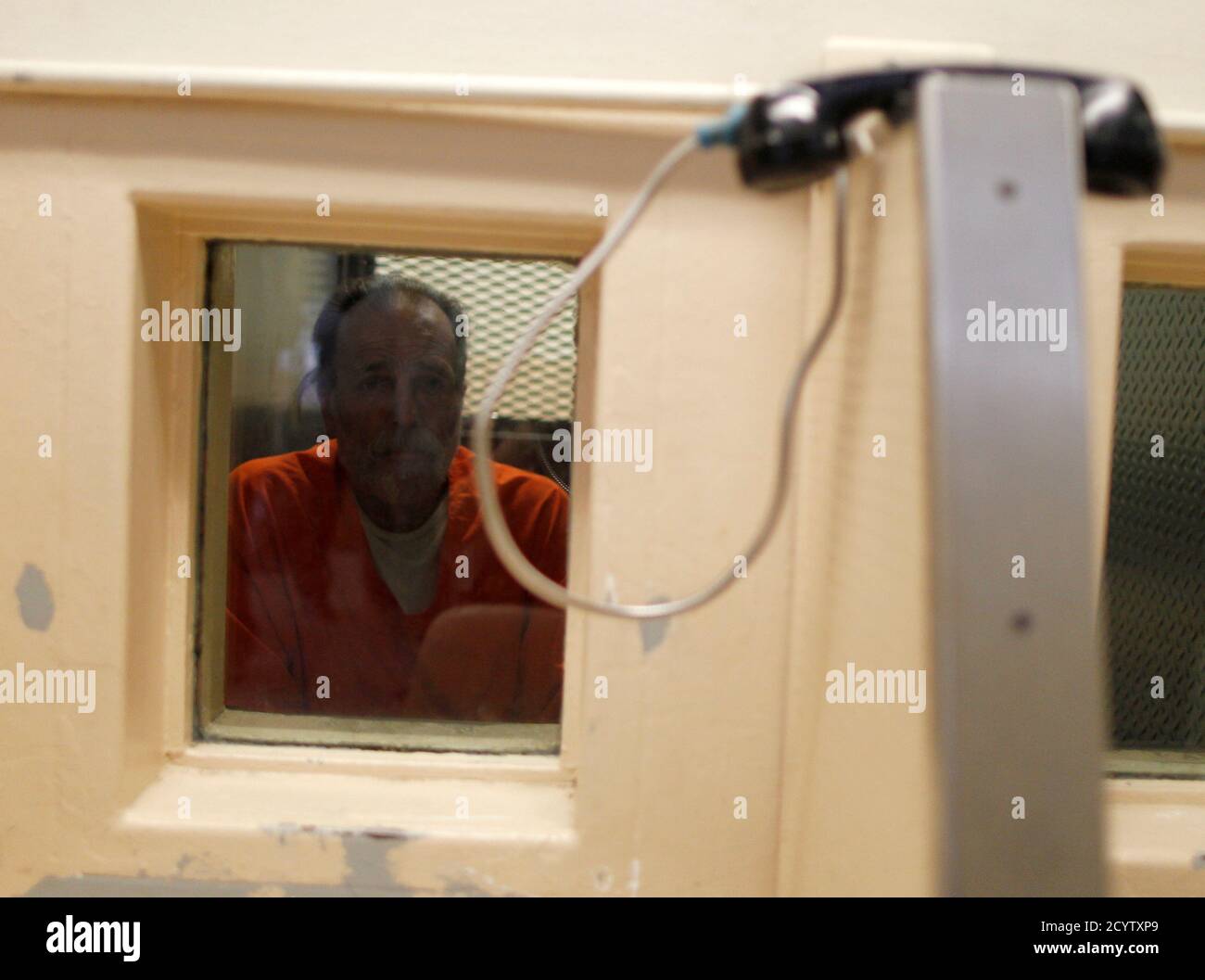 An inmate waits for a visitor at the California Institution for Men state prison in Chino, California, June 3, 2011. The Supreme Court has ordered California to release more than 30,000 inmates over the next two years or take other steps to ease overcrowding in its prisons to prevent "needless suffering and death." California's 33 adult prisons were designed to hold about 80,000 inmates and now have about 145,000. The United States has more than 2 million people in state and local prisons. It has long had the highest incarceration rate in the world. REUTERS/Lucy Nicholson (UNITED STATES - Tags Stock Photo
